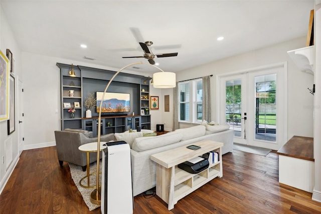 living room with ceiling fan, dark wood-type flooring, and french doors