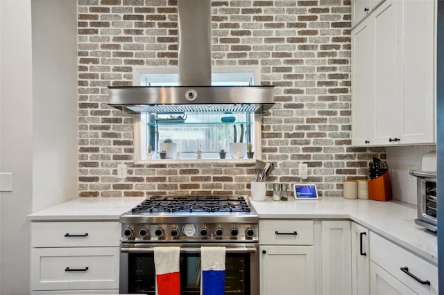 kitchen with white cabinets and high end stove