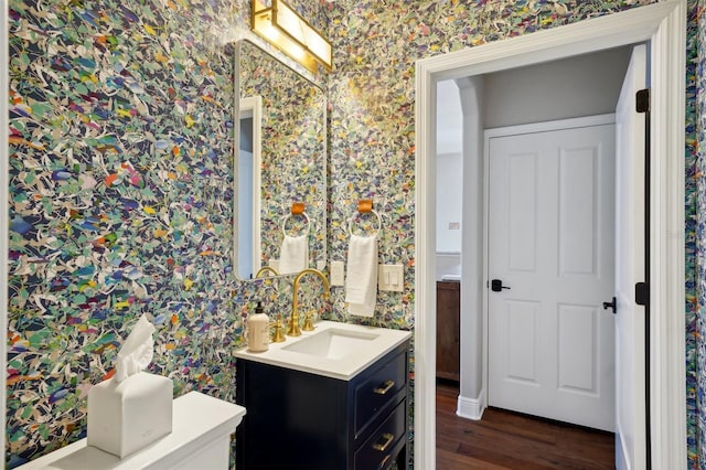 bathroom with vanity and hardwood / wood-style flooring