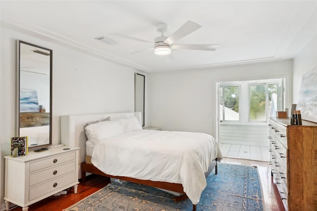 bedroom with ceiling fan and dark hardwood / wood-style floors