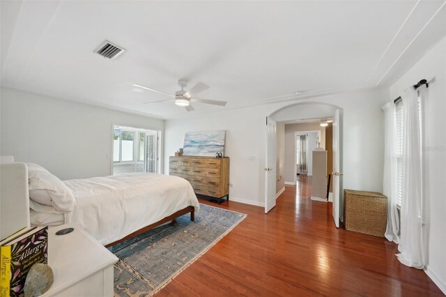 bedroom with wood-type flooring and ceiling fan