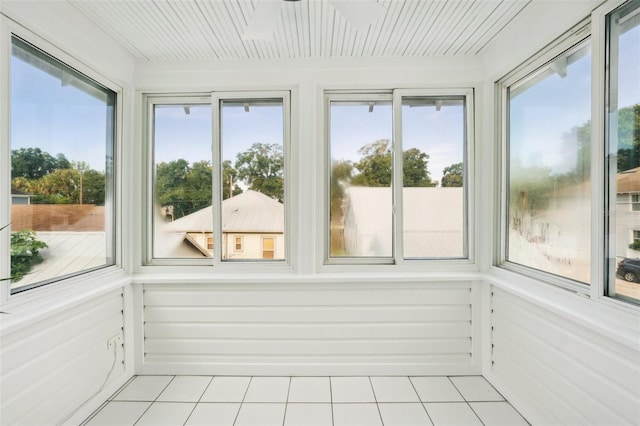 unfurnished sunroom featuring a wealth of natural light