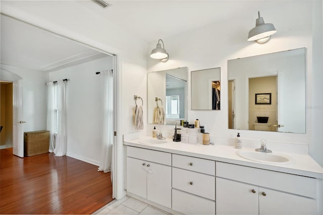 bathroom featuring vanity and hardwood / wood-style flooring