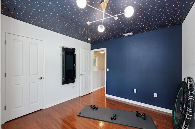 workout room featuring hardwood / wood-style floors