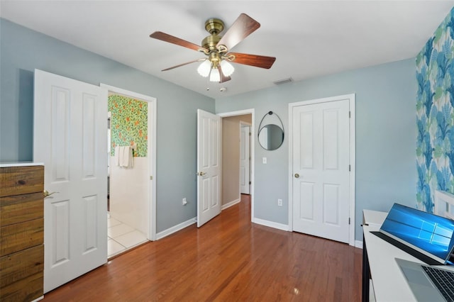 bedroom featuring ceiling fan and hardwood / wood-style flooring