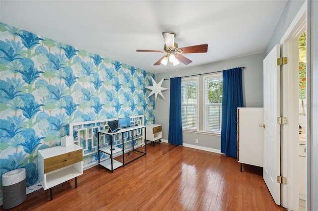 interior space featuring ceiling fan and wood-type flooring