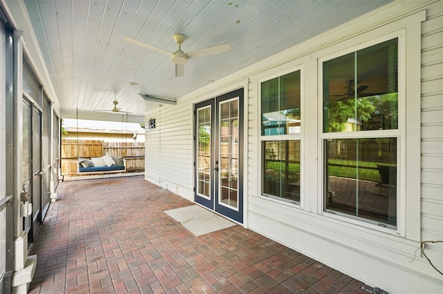 view of patio / terrace featuring ceiling fan and french doors