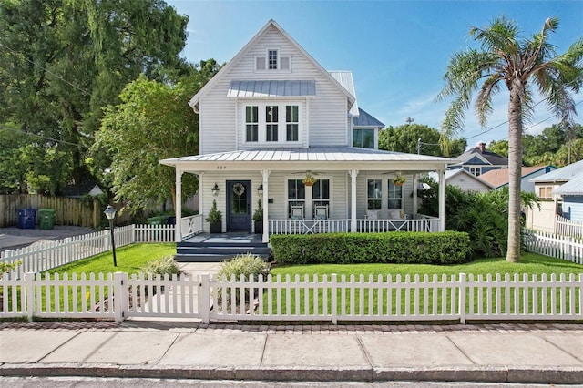 view of front of house with a front lawn and a porch