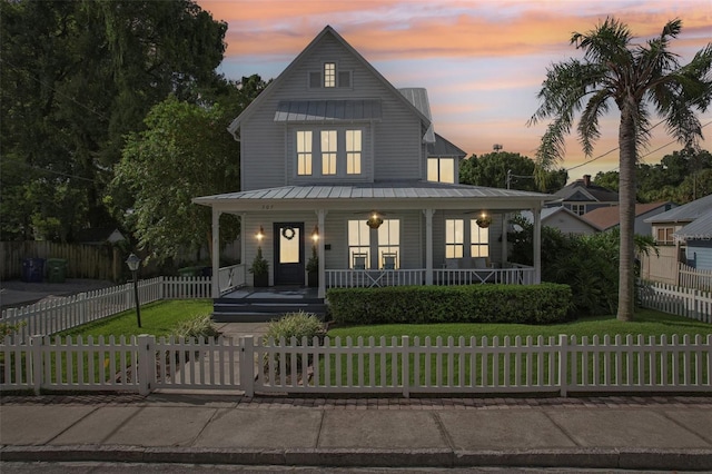 modern inspired farmhouse featuring a yard and a porch