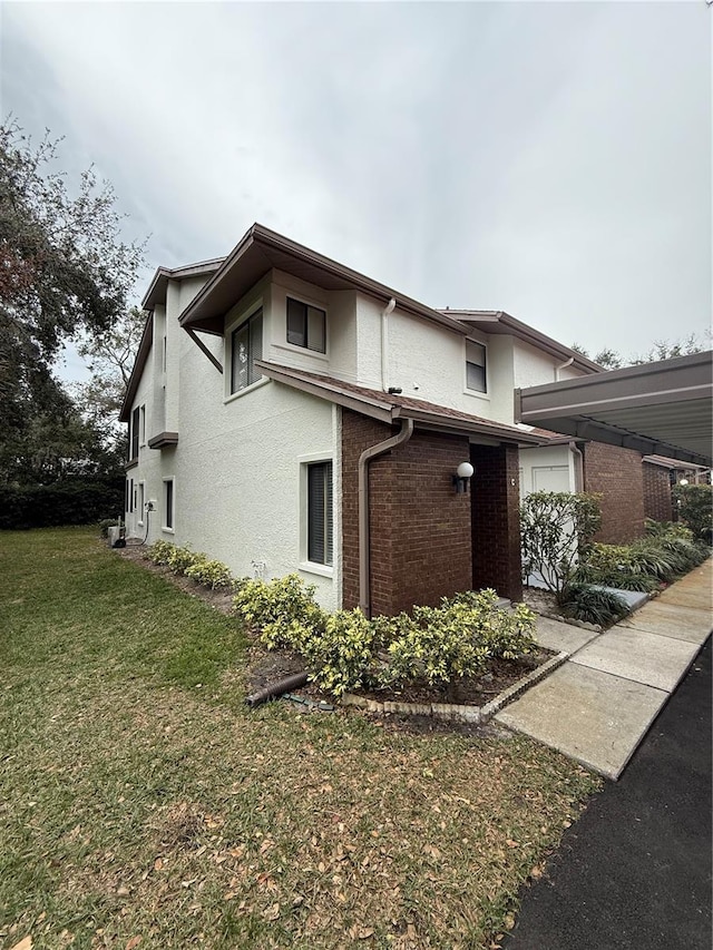 view of home's exterior featuring a yard