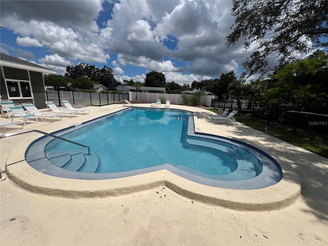 view of swimming pool with a patio area