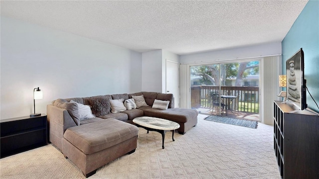 living room featuring a textured ceiling and light colored carpet