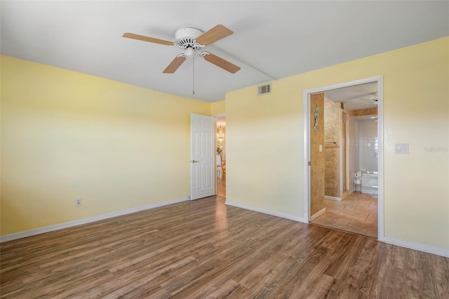 unfurnished room featuring ceiling fan and hardwood / wood-style flooring