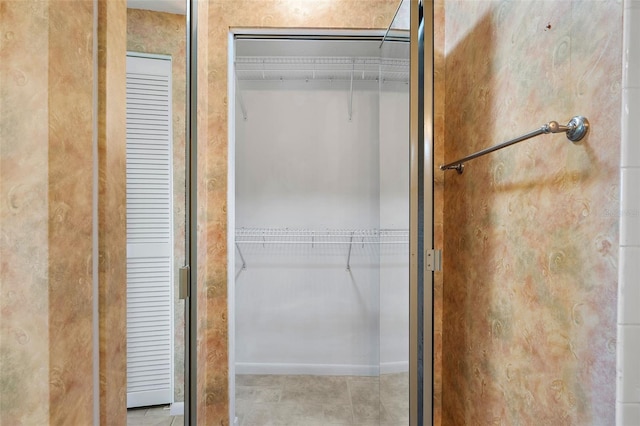 bathroom with tile patterned floors