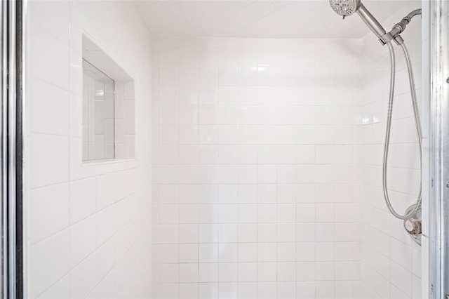 interior space with tiled shower