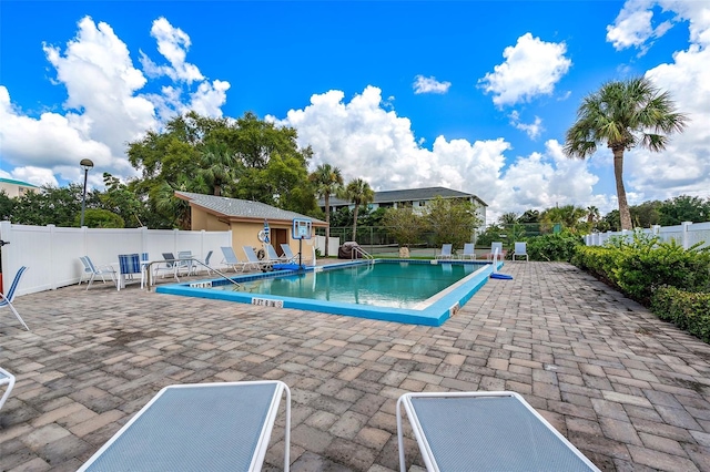 view of swimming pool with a patio