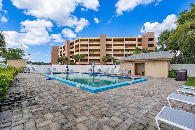 view of swimming pool featuring a patio area