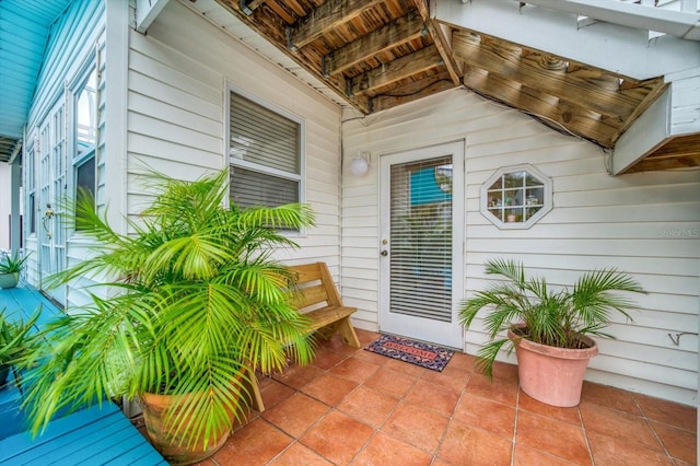 entrance to property with a patio area