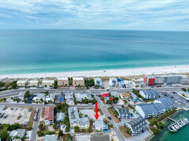 birds eye view of property with a beach view and a water view