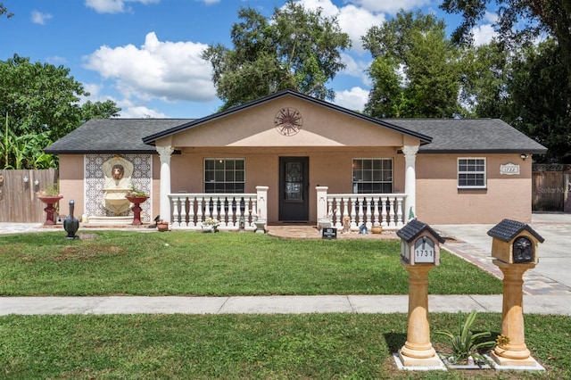 view of front of house featuring a front yard and a porch