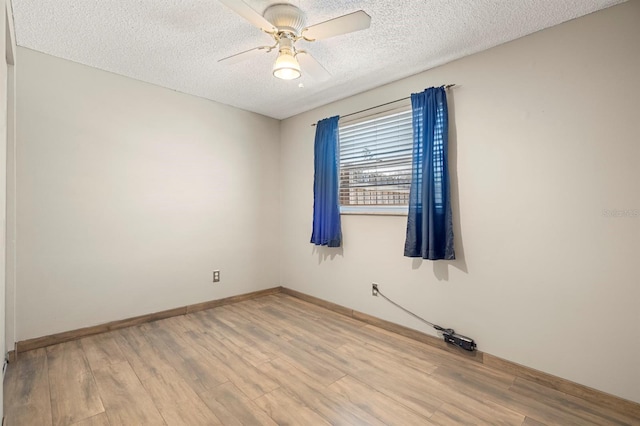 unfurnished room featuring a textured ceiling, ceiling fan, and hardwood / wood-style floors