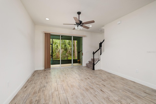 unfurnished room with ceiling fan and light hardwood / wood-style floors