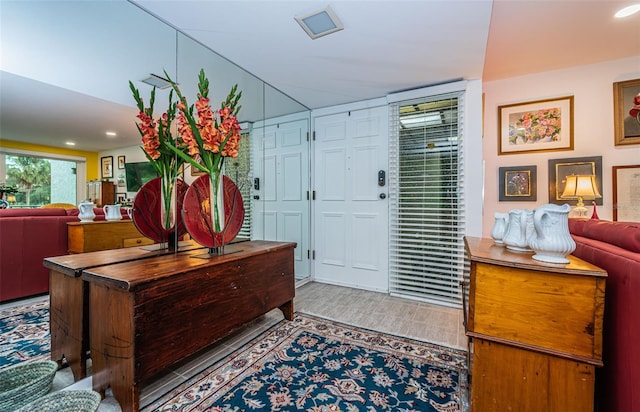 foyer entrance with hardwood / wood-style floors