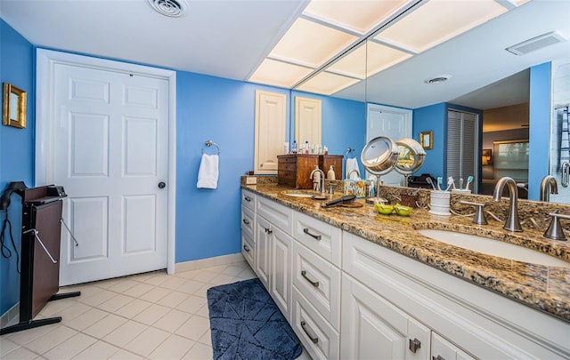 bathroom featuring vanity and tile patterned flooring