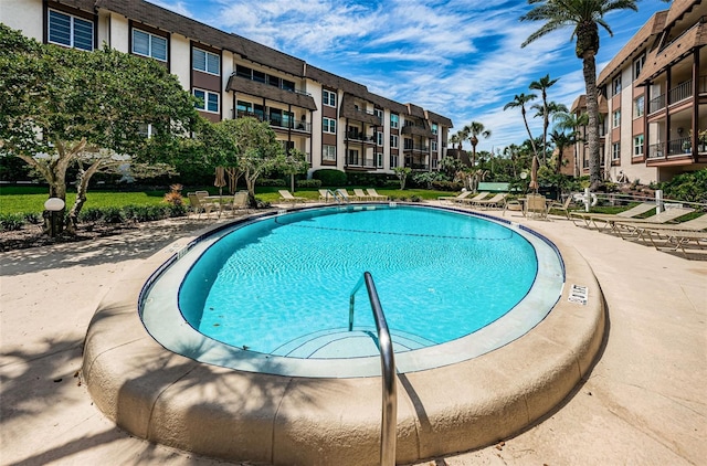 view of swimming pool featuring a patio area