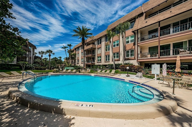 view of swimming pool featuring a patio