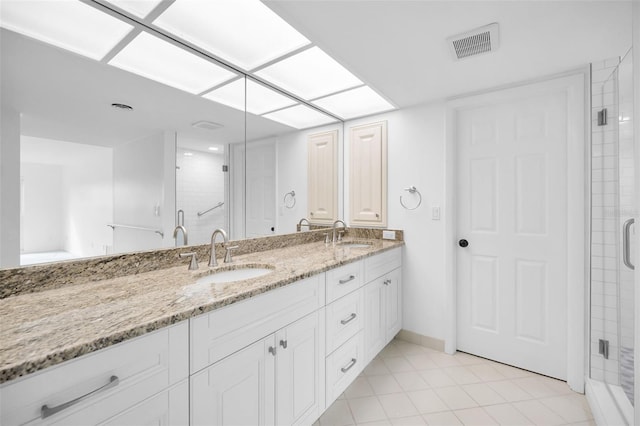 3021 Countryside Blvd Unit 28A, Clearwater, FL 33761 - bathroom featuring tile patterned flooring, walk in shower, and vanity