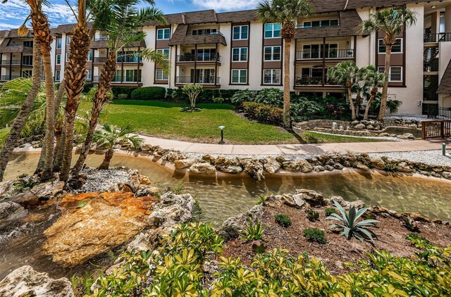 3021 Countryside Blvd Unit 28A, Clearwater, FL 33761 - view of home's community featuring a water view and a lawn