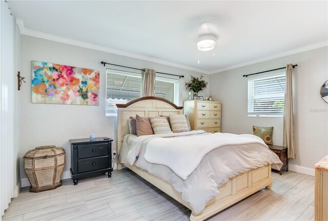 bedroom featuring ornamental molding and ceiling fan