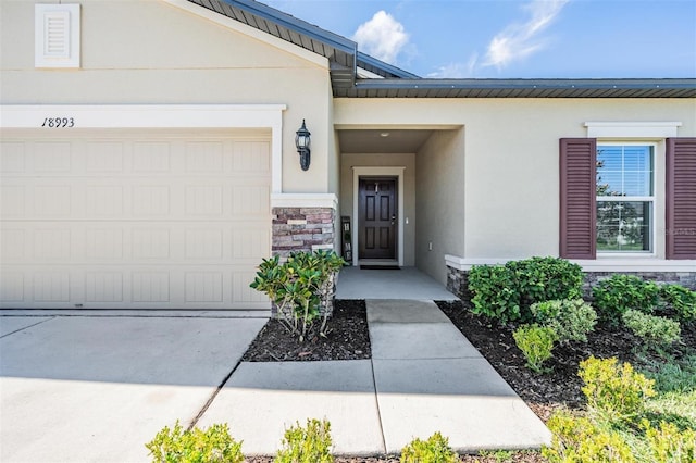 property entrance featuring a garage