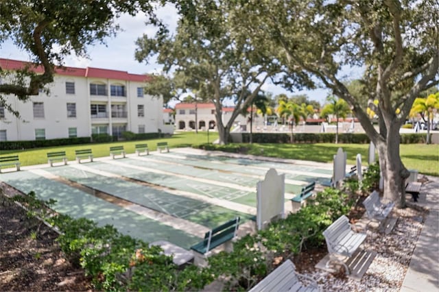 view of home's community with a lawn