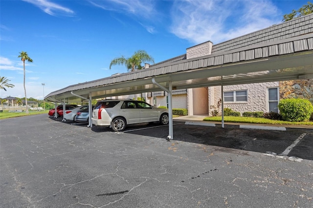 view of vehicle parking featuring a carport