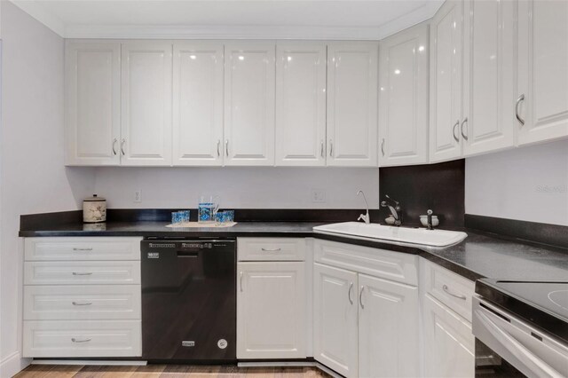 kitchen with light wood-type flooring, black dishwasher, white cabinetry, and sink