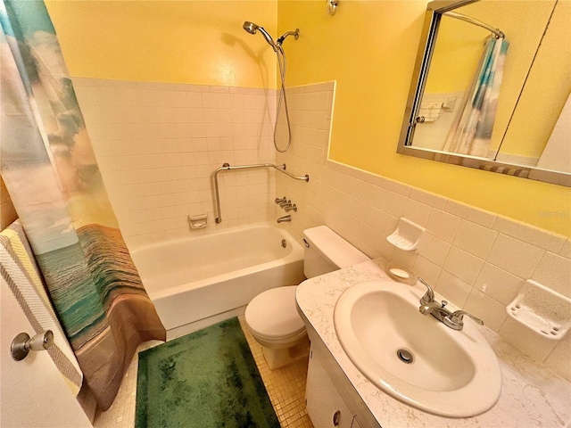 full bathroom with vanity, shower / tub combo, tasteful backsplash, tile walls, and toilet