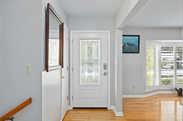 foyer entrance with light wood-type flooring