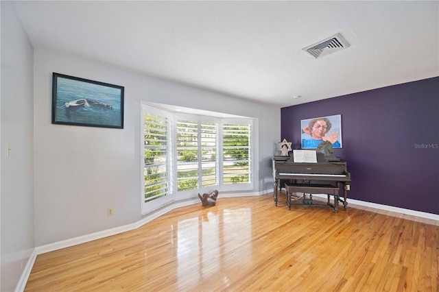 miscellaneous room featuring hardwood / wood-style floors