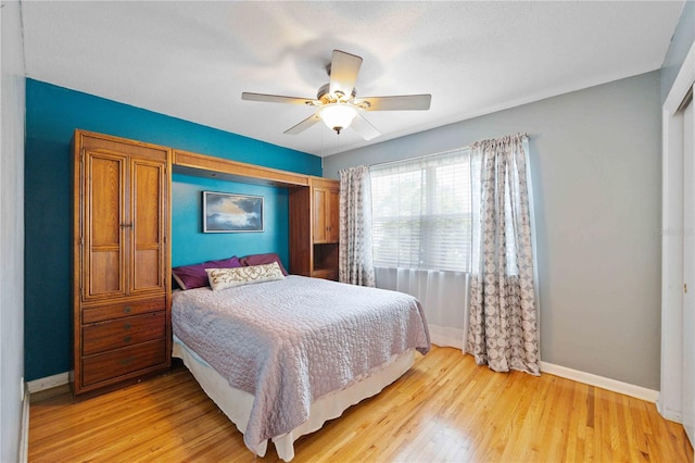 bedroom featuring ceiling fan and light wood-type flooring