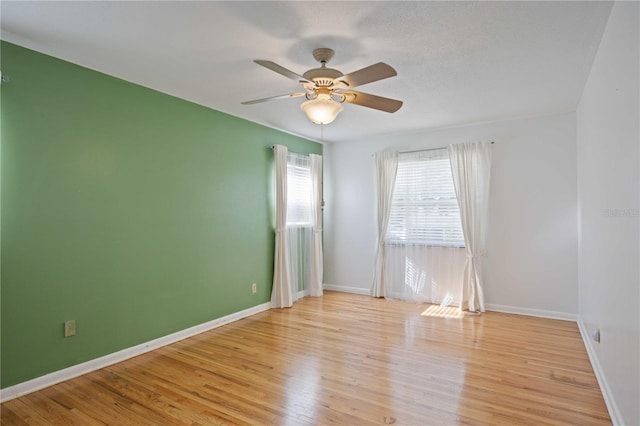 empty room featuring light hardwood / wood-style floors and ceiling fan