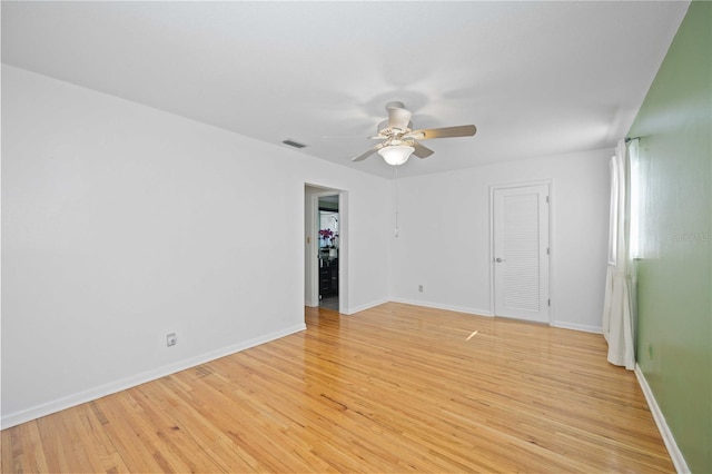 unfurnished room with ceiling fan and light hardwood / wood-style flooring