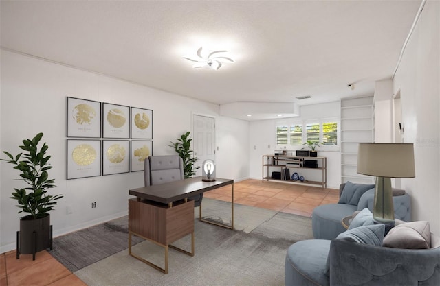 office space featuring light tile patterned floors and a textured ceiling