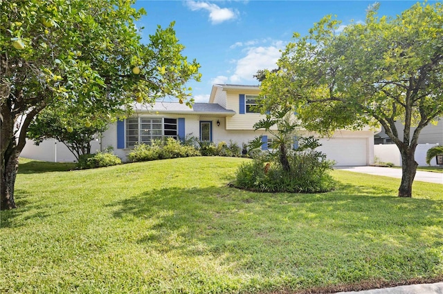 view of front facade featuring a front yard and a garage