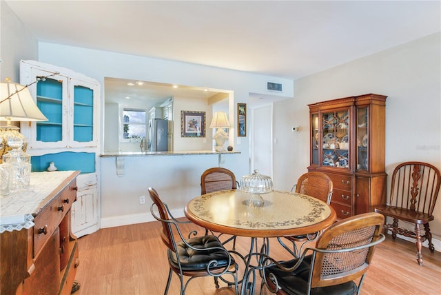 dining room featuring light hardwood / wood-style flooring