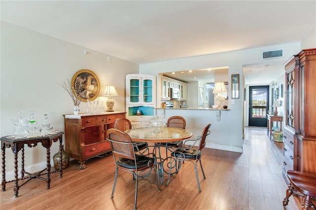 dining room with light wood-type flooring