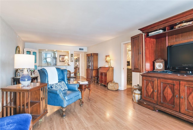 living room with light hardwood / wood-style floors