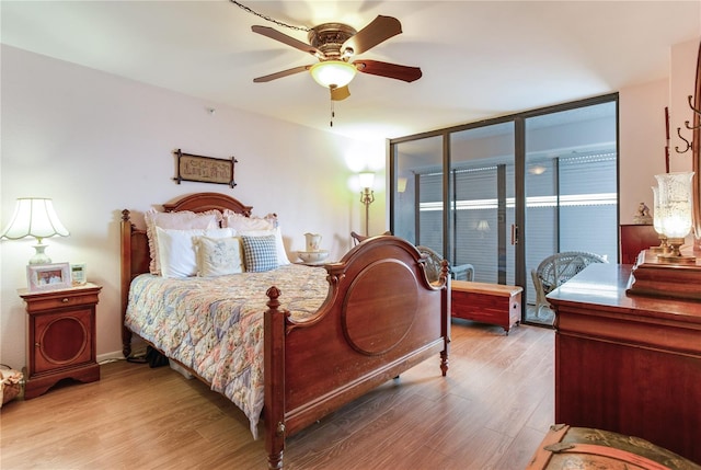 bedroom with access to outside, ceiling fan, and light hardwood / wood-style floors