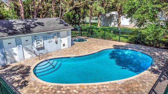 view of swimming pool with a patio area